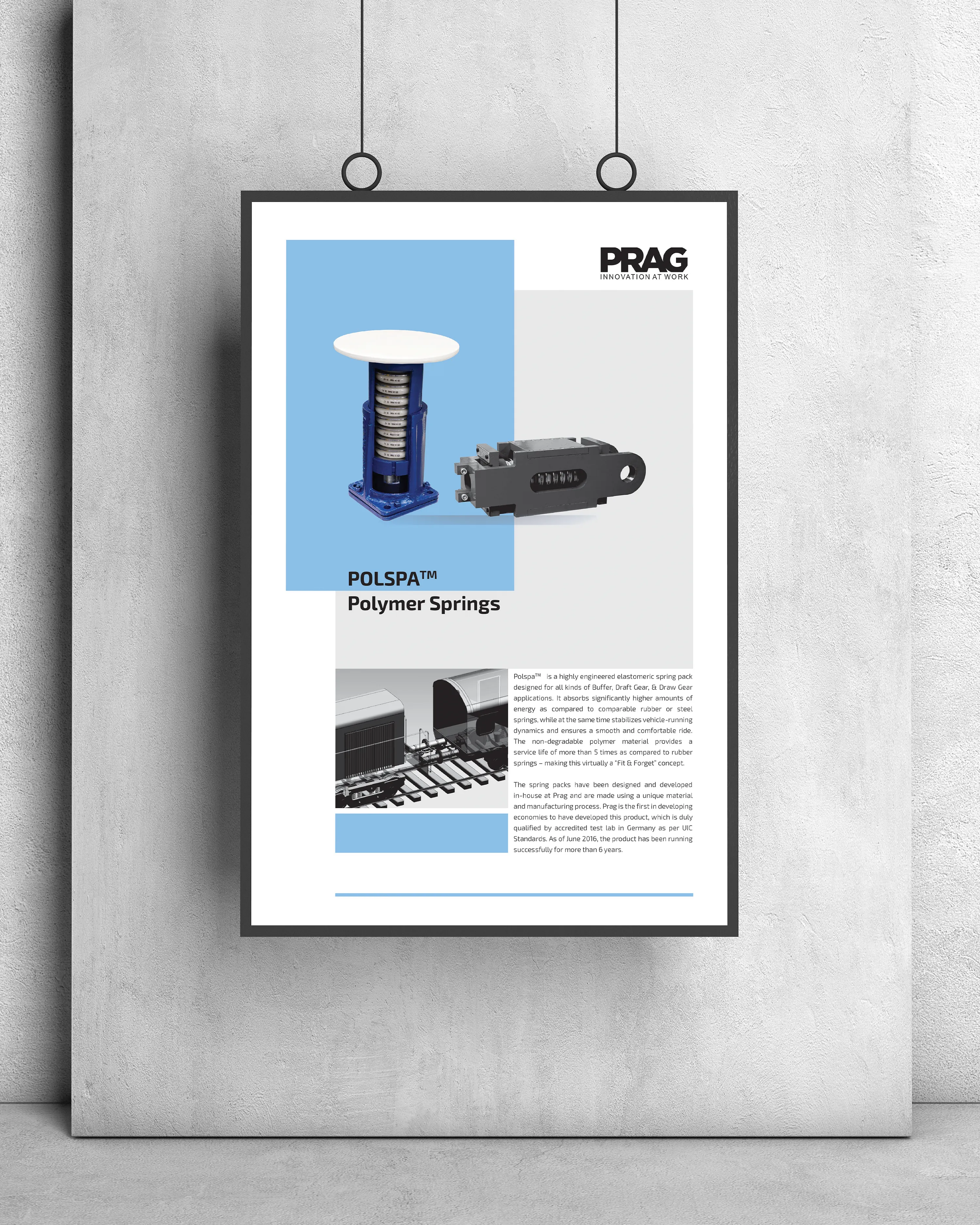 PRAG marketing poster for an industrial product, displayed in a hanging frame.